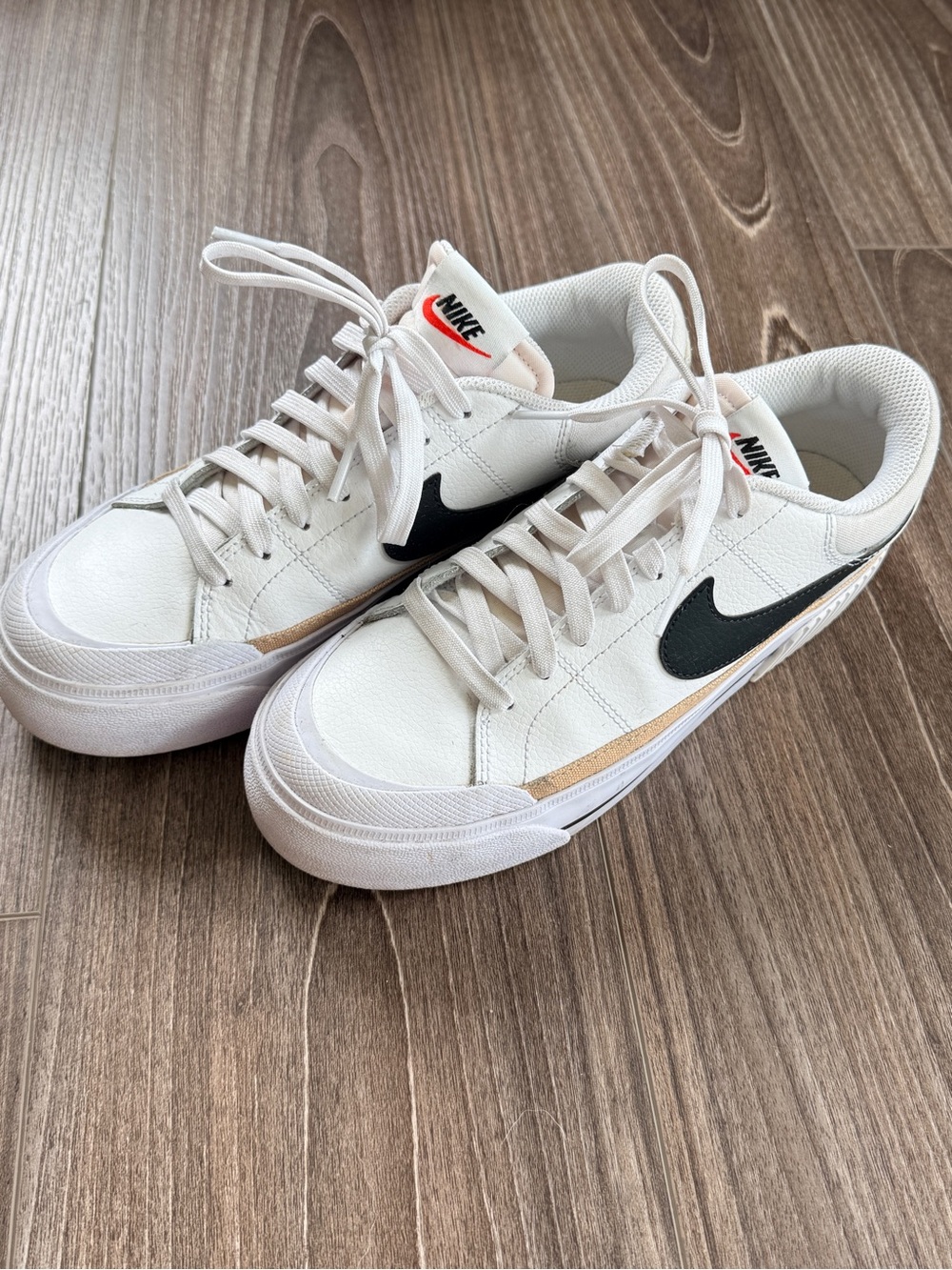 Nike Men’s White Sneakers with Black Swoosh and Tan Accent